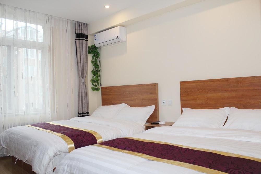 Dalian Kai Bin Business Inn Bagian luar foto